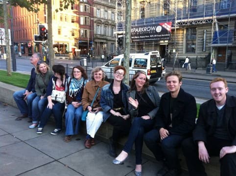 Phil Kirby, Abby Dix Mason, Katie Bolton, Alexandra Boyle, Lynn Hill, Elly Snare, Lucy Meredith. Robert Snare and Mark O'Brien gather in a continental school trip kind of way before embarking on their secret surprise event